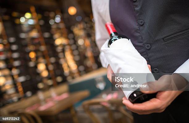 Man Hoding A Bottle Of Wine Stock Photo - Download Image Now - Restaurant, Party Host, Sommelier