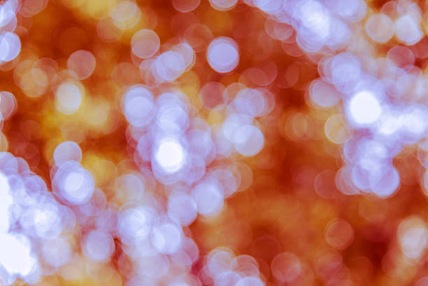 sfocatura bokeh da albero naturale - defocused illuminated glitter orange foto e immagini stock