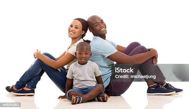 Young Afro American Family Sitting On The Floor Stock Photo - Download Image Now - Cut Out, Family, Sitting