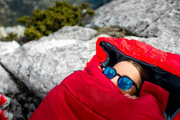 istock Woman in sleeping bag on the mountain 469217898
