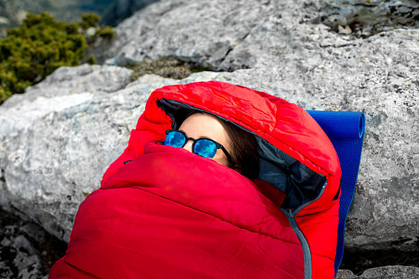 istock Woman in sleeping bag on the mountain 469218466