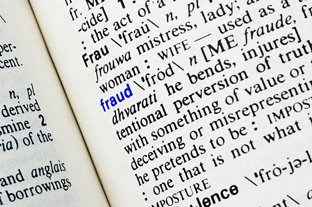 istock Fraud. Closeup of dictionary word entry. 469218514