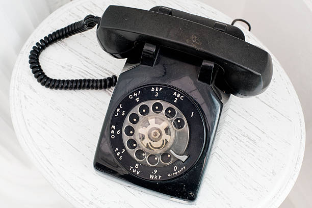 istock Vintage telephone on white table background 469218544