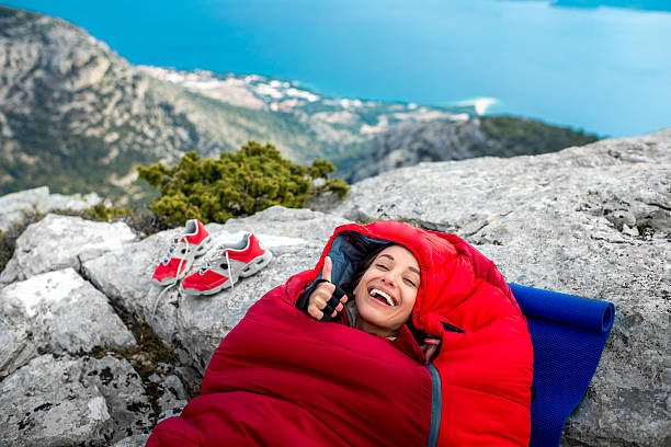 istock Woman in sleeping bag on the mountain 469218764