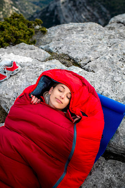 istock Woman in sleeping bag on the mountain 469218852