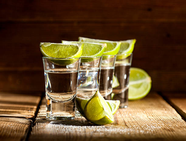 tequila - tequila shot tequila salt lemon stock-fotos und bilder