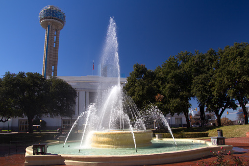 Dallas sky tower. Water fountain in the foreground