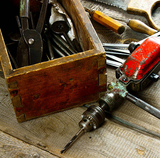 istock Drills in box, drill, chisel on a wooden background 469220134