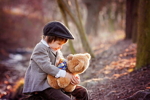 istock Adorable little boy with his teddy bear friend 469222304