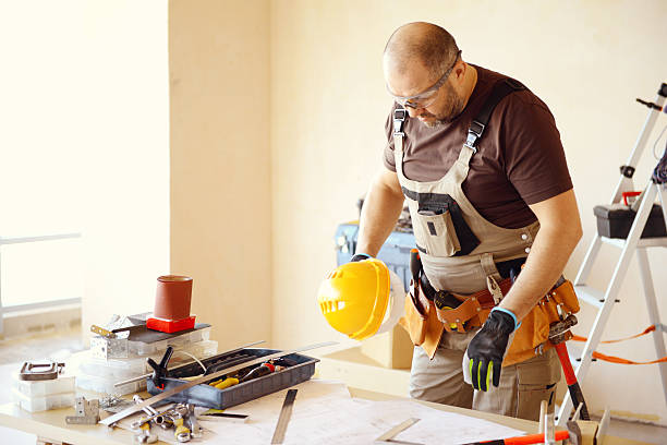 istock Male carpenter in working clothes in a construction workshop 469222694