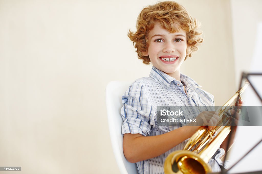 Music makes me smile Shot of a cute little boy playing the trumpethttp://195.154.178.81/DATA/i_collage/pu/shoots/785501.jpg 2015 Stock Photo