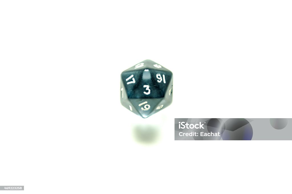 Number 3 on green twenty sided dice isolated on white Number 3 on a dark green, plastic, twenty sided dice with green shade, isolated against a white background. 2015 Stock Photo