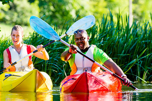 istock Friends driving with kayak on forest river 469223642