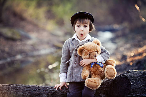 istock Adorable little boy with his teddy bear friend 469224040