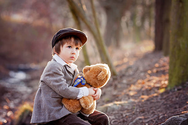 istock Adorable little boy with his teddy bear friend 469224238