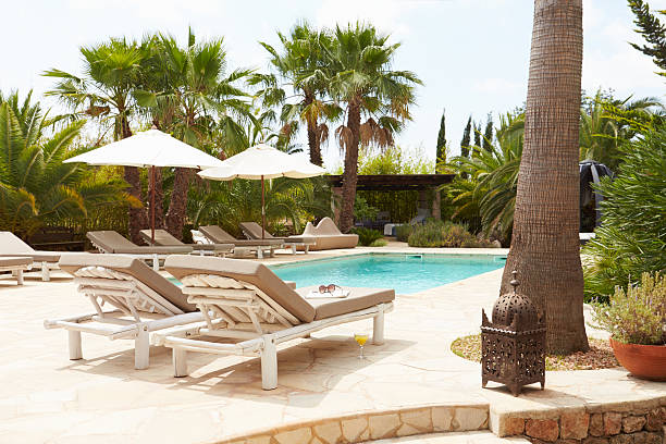 istock Luxury Hotel Swimming Pool With Loungers 469226286