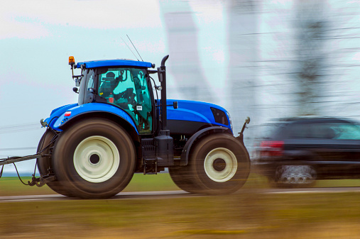 tractor hastily goes on field