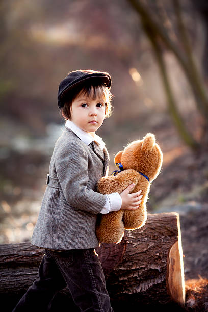 istock Adorable little boy with his teddy bear friend 469230198