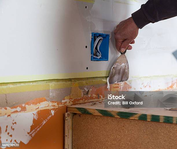 Fixing Wall Stock Photo - Download Image Now - 2015, Adult, Adults Only