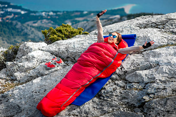 istock Woman in sleeping bag on the mountain 469233068