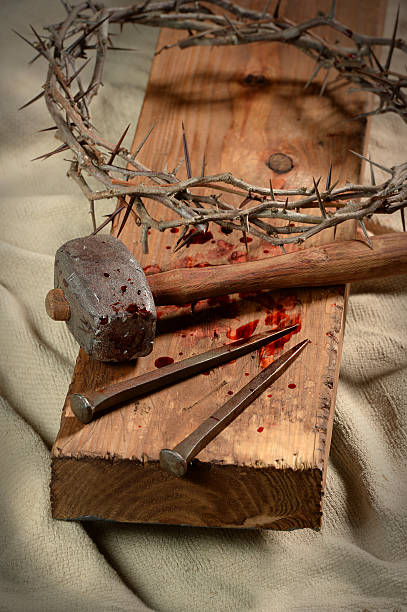 istock Cross With Nails, Crown of Thorns and Hammer 469233876