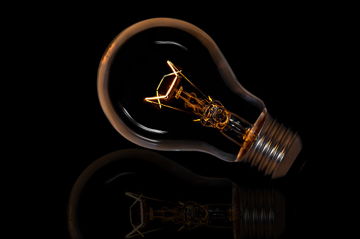 incandescent light bulb isolated on black background