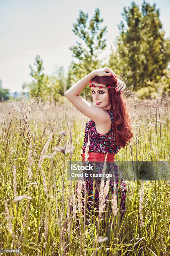 Beautiful hippie girl with rose headband Romantic beautiful girl outdoors in summer, hippie style 2015 Stock Photo