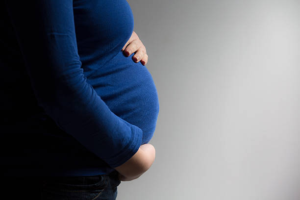istock Expecting Mom Holding Her Tummy 469234624
