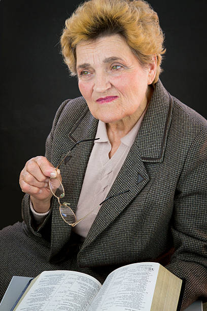 istock Senior woman reading holly bible 469234888