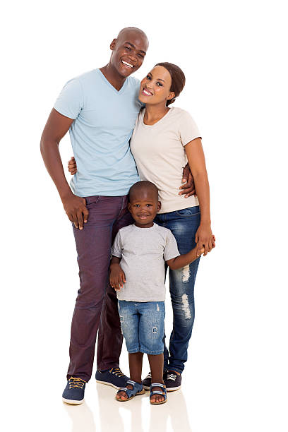 istock young african couple standing with their son 469235004