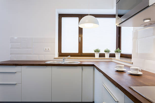 istock Wooden worktops and white cupboards 469235092