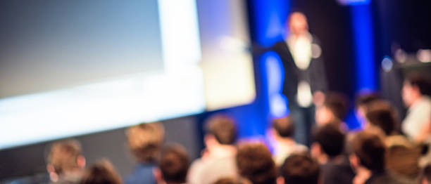 istock Large Group of People Listening to a Presentation 469237930