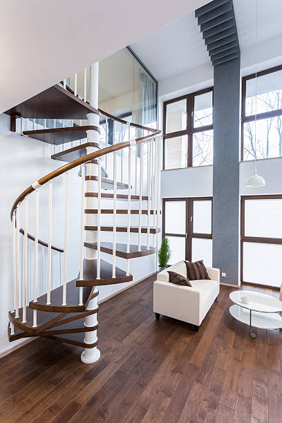 istock Spiral stairs in luxury mansion 469238072