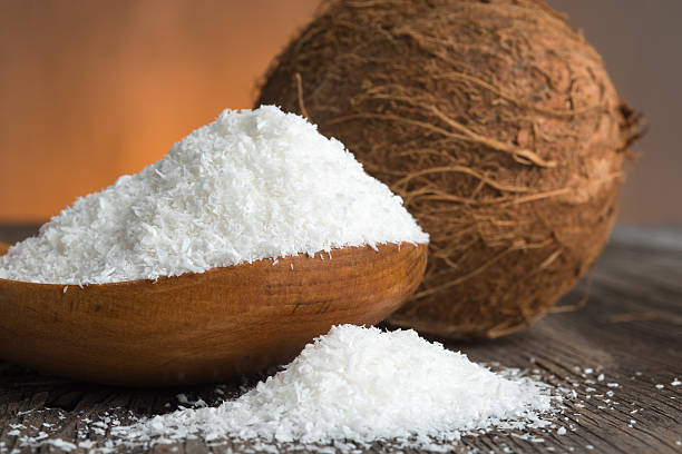 istock Coconut and coconut flakes on wood 469239376