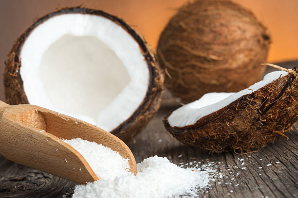 istock Coconut and coconut flakes on wood 469239378