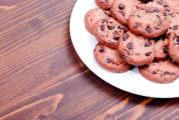istock Delicious chocolate chip cookies on the board top view 469239832