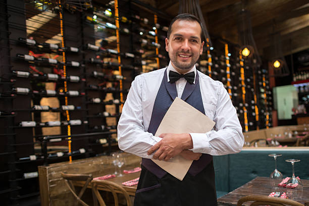 istock Waiter holding menu at a restaurant 469240552