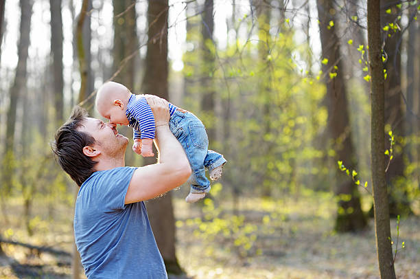 istock Man holding his little baby 469240918