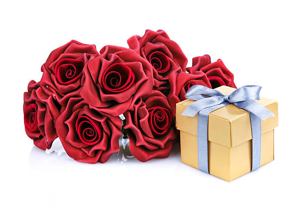 istock red flowers and golden gift box 469240990