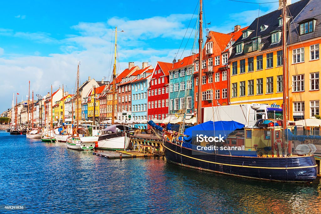 Nyhavn, Copenhagen, Denmark Scenic summer view of Nyhavn pier with color buildings, ships, yachts and other boats in the Old Town of Copenhagen, Denmark Copenhagen Stock Photo