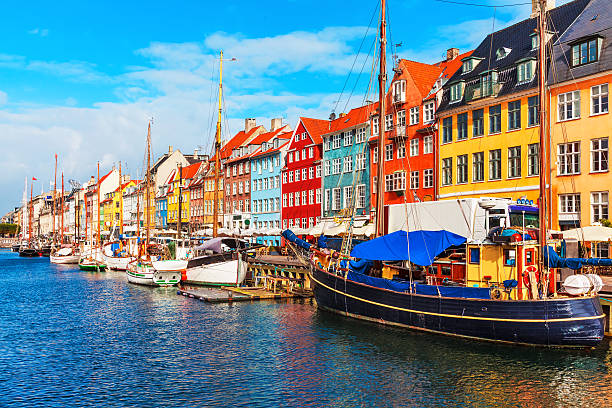Nyhavn, Copenhagen, Denmark Scenic summer view of Nyhavn pier with color buildings, ships, yachts and other boats in the Old Town of Copenhagen, Denmark old port photos stock pictures, royalty-free photos & images