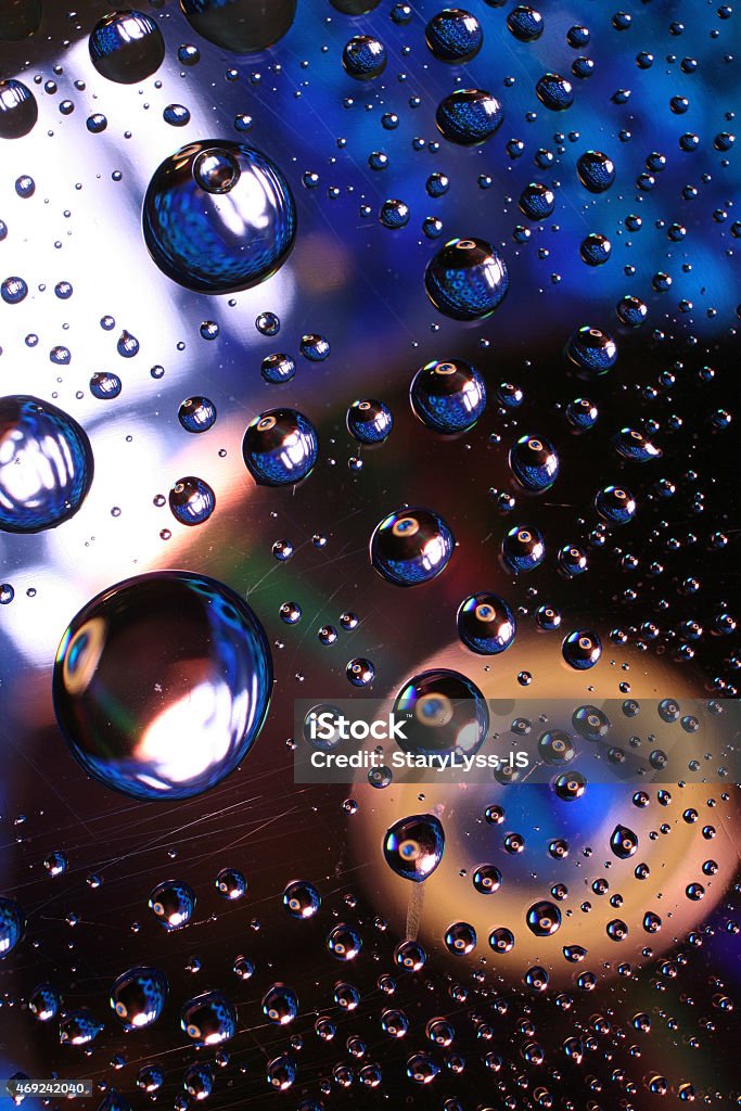 Water drops on plastic surface Water drops on plastic surface with refracted image 2015 Stock Photo