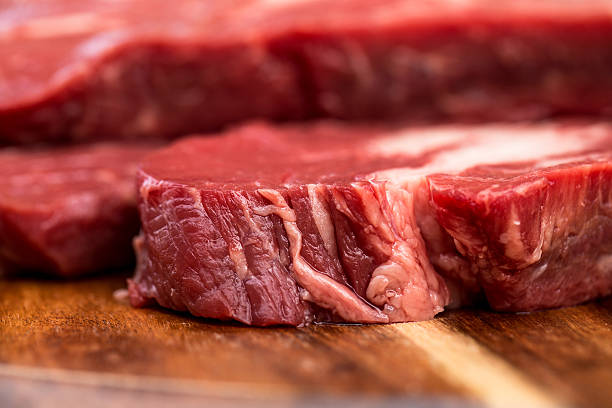 istock Fresh beef steaks on wooden board 469245824
