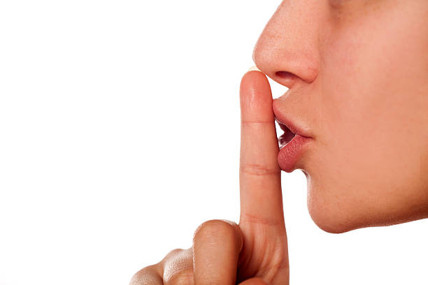 finger on the lips finger on the lips. sign for silence silence stock pictures, royalty-free photos & images