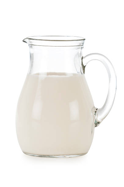 istock Glass pitcher filled with milk. 469246098