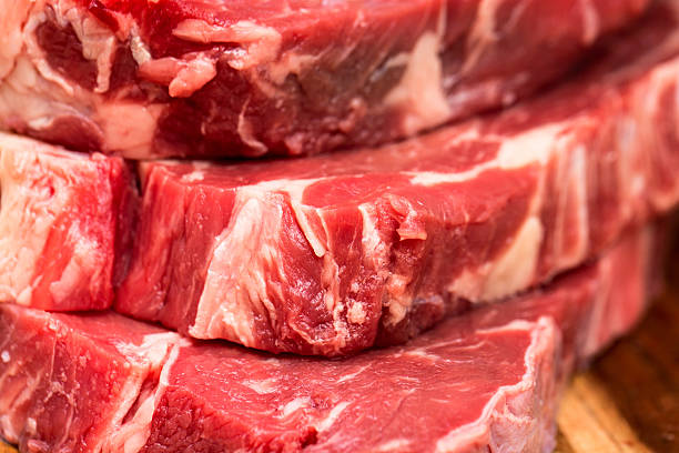 istock Fresh beef steaks on wooden board 469246536