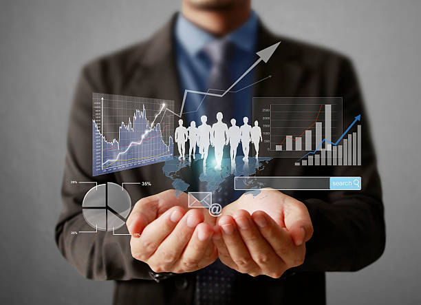 istock Businessman with financial symbols 469249768