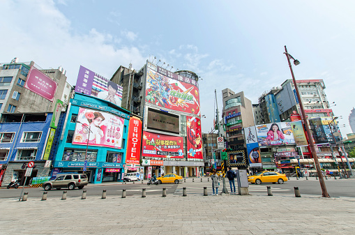 Taipei,Taiwan - March 16,2015 : Day scene of the Ximending, it is the source of Taiwan's fashion, subculture, and Japanese culture.People can seen walking and shopping around it.