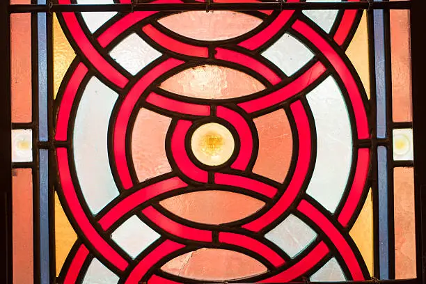 Partial view of a stain-glass window in a 19th century synagogue in New York City. Amazing geometric shapes and patterns.