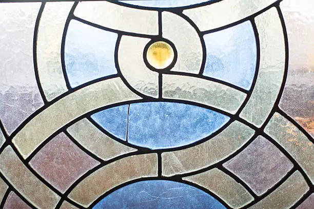 Partial view of a stain-glass window in a 19th century synagogue in New York City. Amazing geometric shapes and patterns.